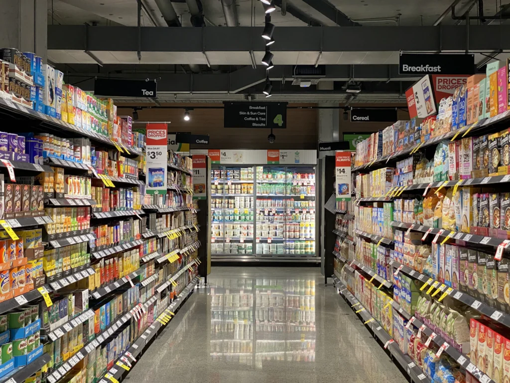 A bright, well-stocked grocery aisle
